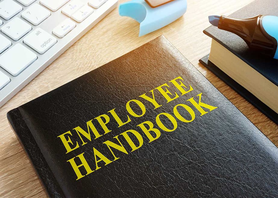 This is a photo of an employee handbook, as employee handbook creation services are one of our specialties.