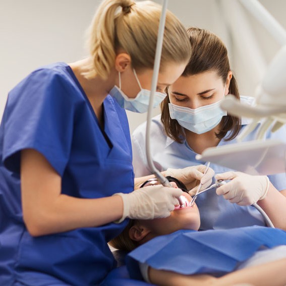 Dental HR policies: An HR specialist creating HR policies for dental clinics.